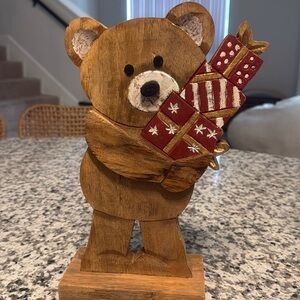 Wooden Bear holding gifts